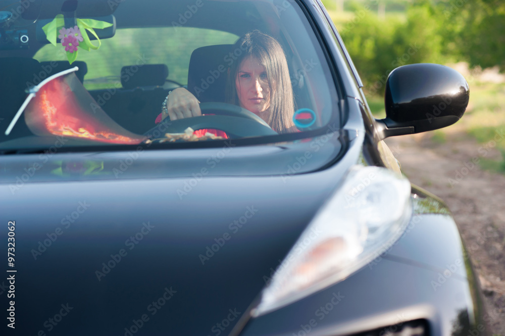 Young woman driving car