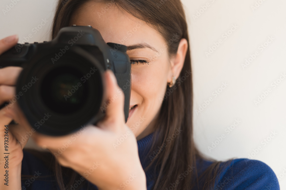 Brunette woman photographer taking pictures with camera Brunette woman photographer taking pictures with camera