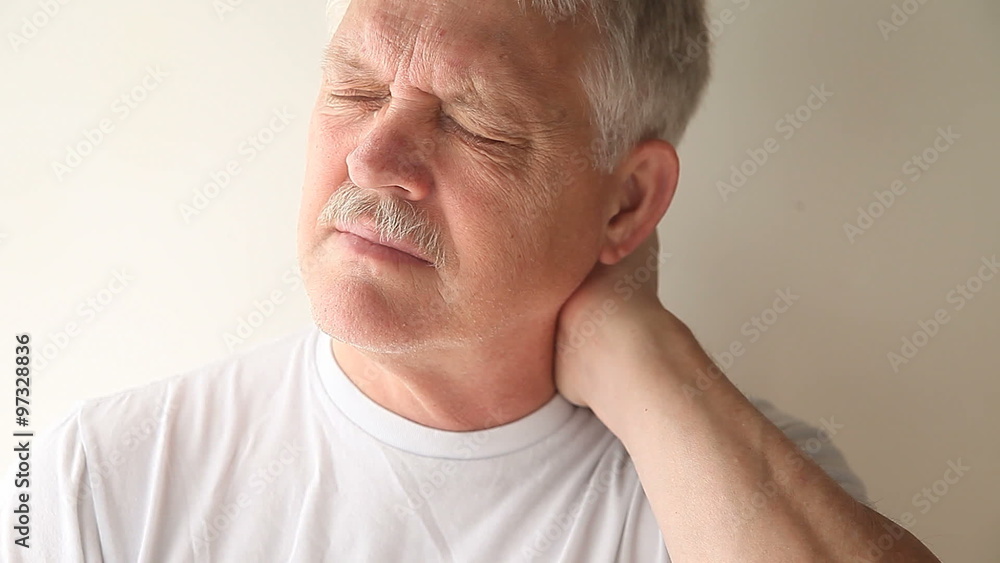 senior man experiencing pain and stiffness in his neck