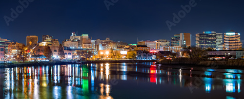 Wilmington skyline panorama reflected in Christiana River. Wilmington, the largest city in the state of Delaware, is built on the site of Fort Christina, the first Swedish settlement in North America
