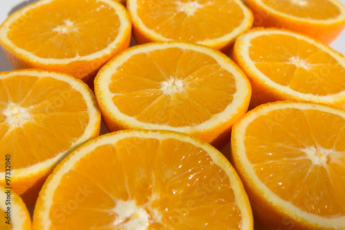 halved oranges , sliced orange fruits closeup