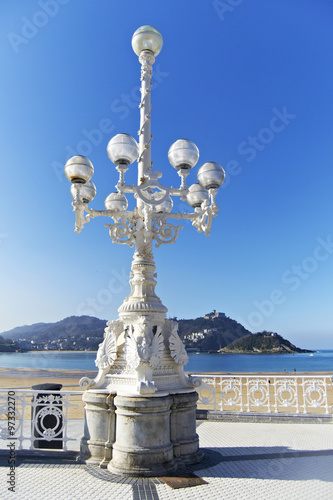 Lamppost with Shell Beach and Mount Igueldo to the fund, San Sebastian photo