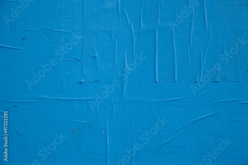 Blue paint and peeling paper
