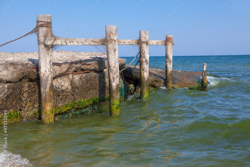Fototapeta premium wooden poles in sea