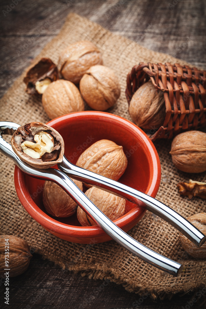 walnuts with nutcracker walnuts with nutcracker