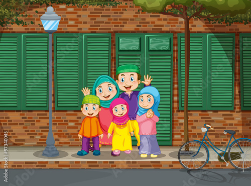 Muslim family standing by the road