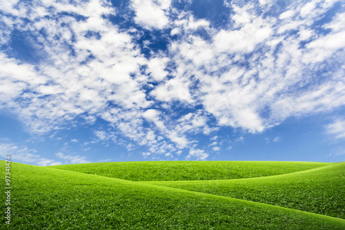 Green field top on blue sky and clouds for background