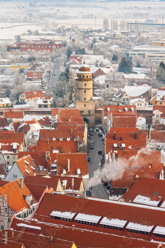 Winter panorama of medieval town within fortified wall. Top view from 