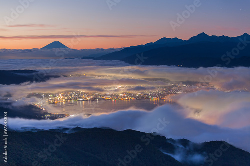 Beautiful Mountain Fuji and lake suwa at sunrise time in autumn season seen from Mt. Takabocci photo