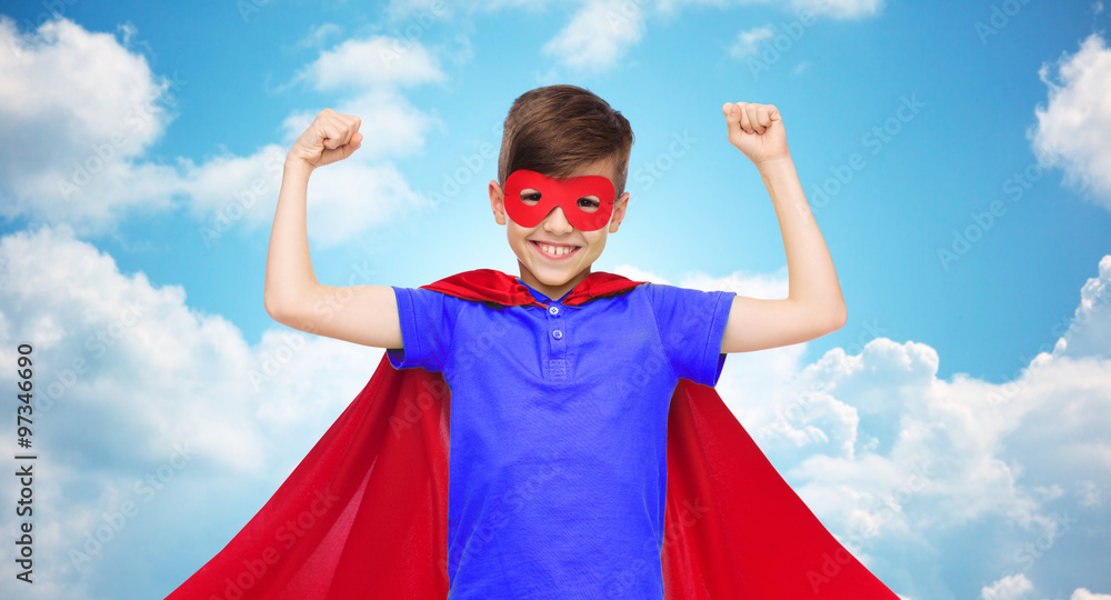 boy in red super hero cape and mask showing fists boy in red super hero cape and mask showing fists