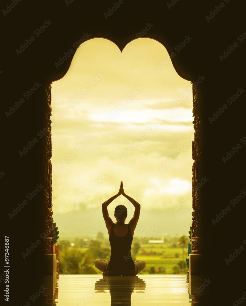 Silhouette of a beautiful Yoga woman in the morning - vintage st
