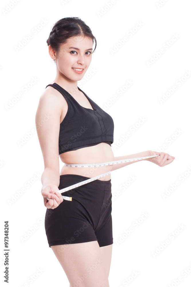 Fitness young woman taking measurements of her body. healthy concept Fitness young woman taking measurements of her body. healthy concept