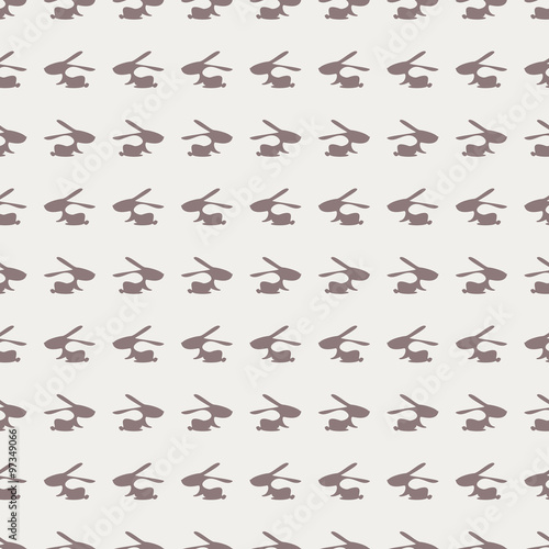 Seamless animal vector pattern, background with rabbits, grey silhouette over light backdrop.