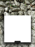 Single hanged square frame on ancient stone wall background