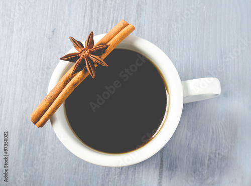 Cup of coffee with cinnamon stick , with matte filter