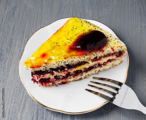 Slice of delicious pie on plate with fork