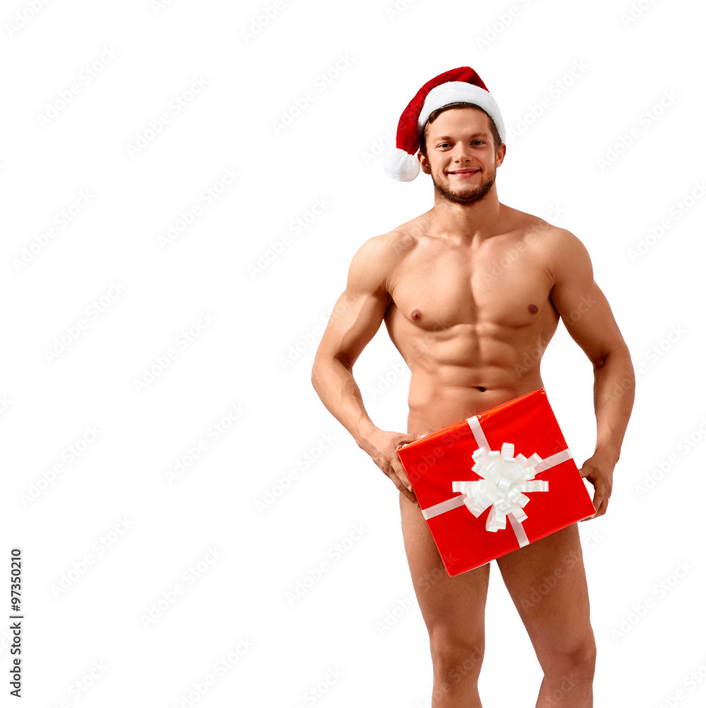 Got some presents. Naked Santa Claus with hot body covering himself with a  present smiling to the camera Stock Photo | Adobe Stock