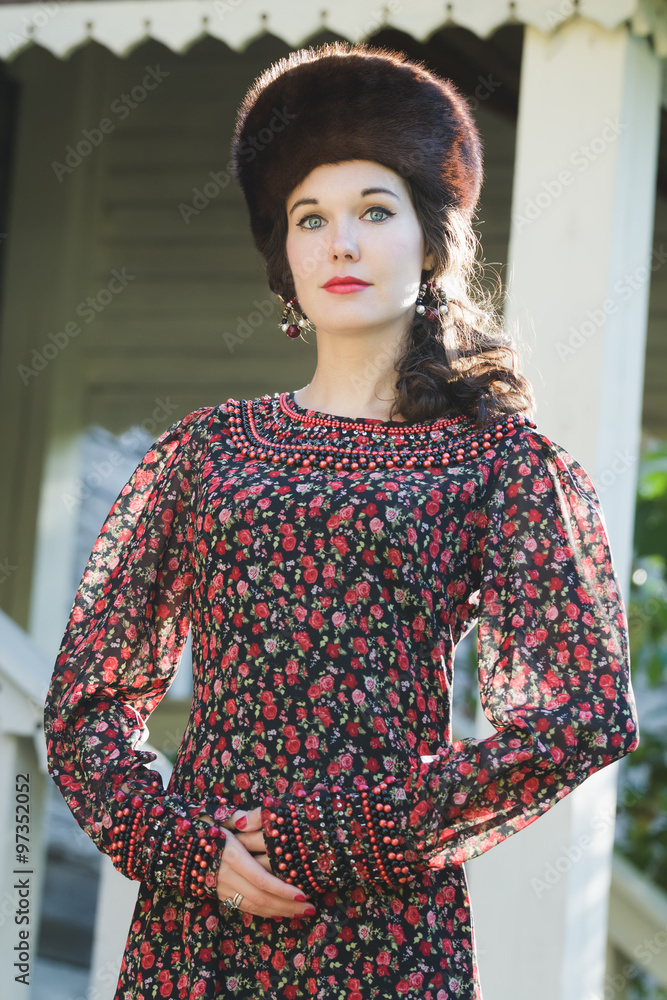 Outdoor fashion portrait of young woman in Russian medieval style clothing with fur Cossack hat Stock Photo Adobe Stock