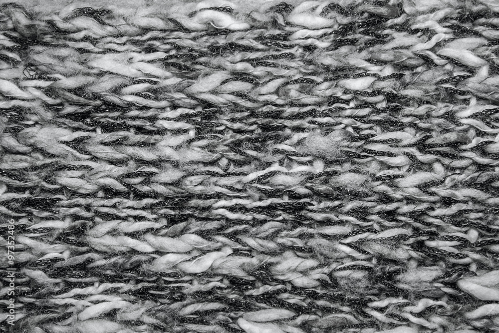 Obraz premium Gray melange fluffy woven thread sweater or scarf as a backgroun