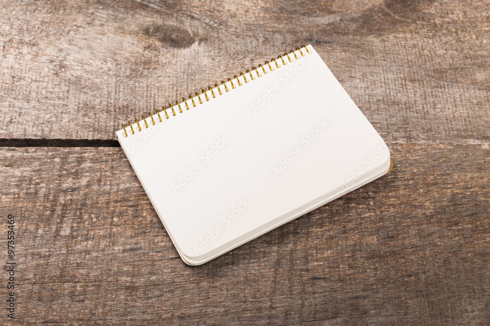 Notebook on wood table for background Notebook on wood table for background