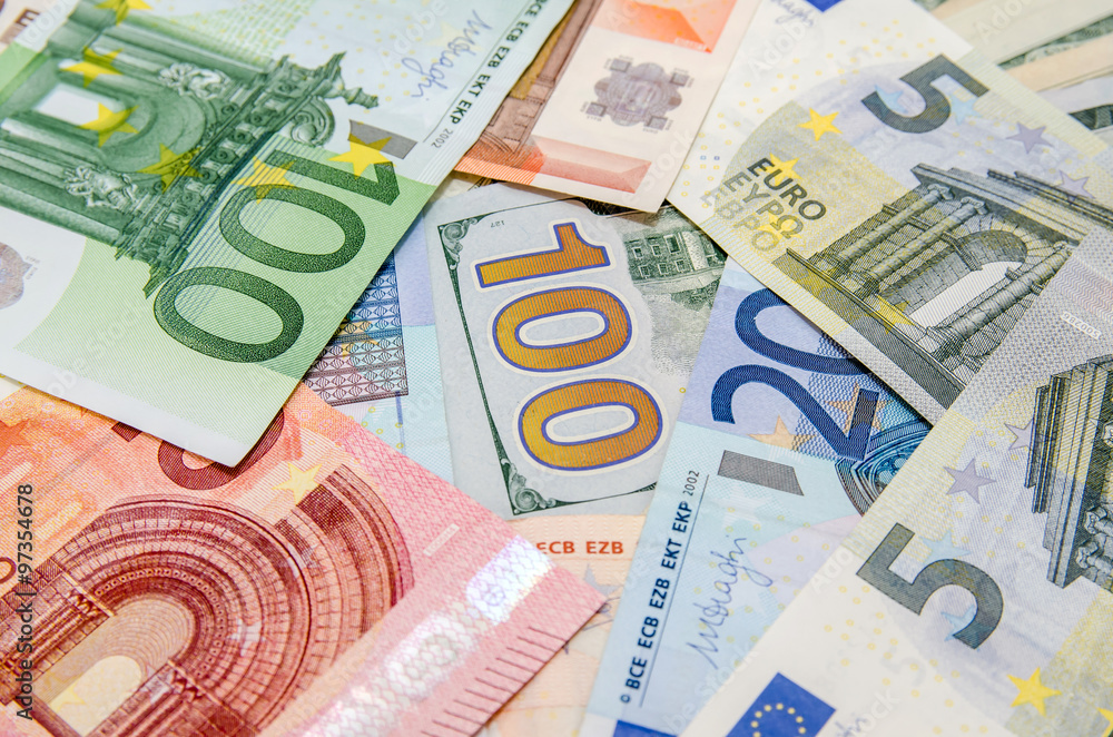 Pile of many different us dollars and euro Pile of many different us dollars and euro