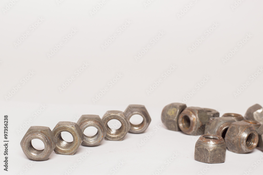 Metal and steel nuts on white background Metal and steel nuts on white background