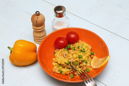 paella with seafood in a ceramic plate