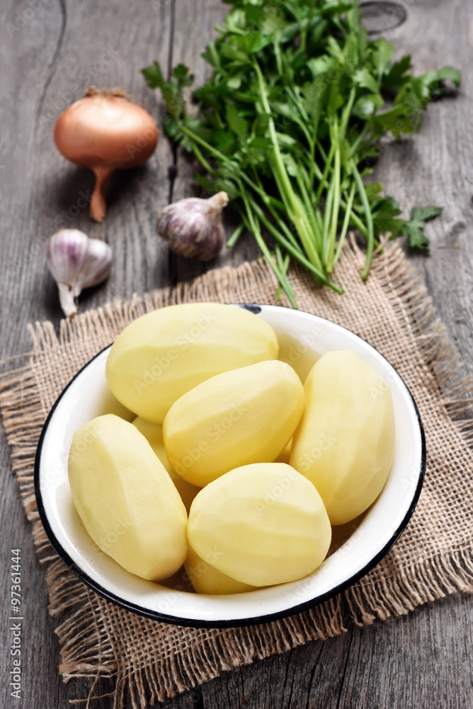 Peeled potatoes and vegetables