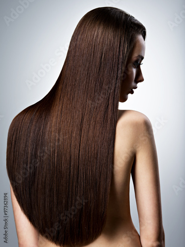 Portrait of beautiful woman with long straight brown hair