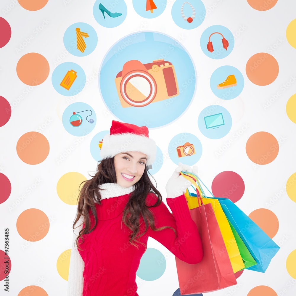 Festive brunette in winter wear holding shopping bags Festive brunette in winter wear holding shopping bags