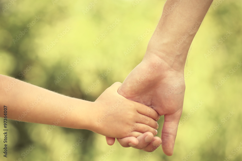 Father and daughter hands outdoors Father and daughter hands outdoors