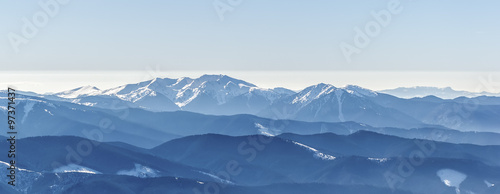 Distant sharp peaks. blue mountain ranges. Ukrainian Carpathian Mountains © oleksandrmazur