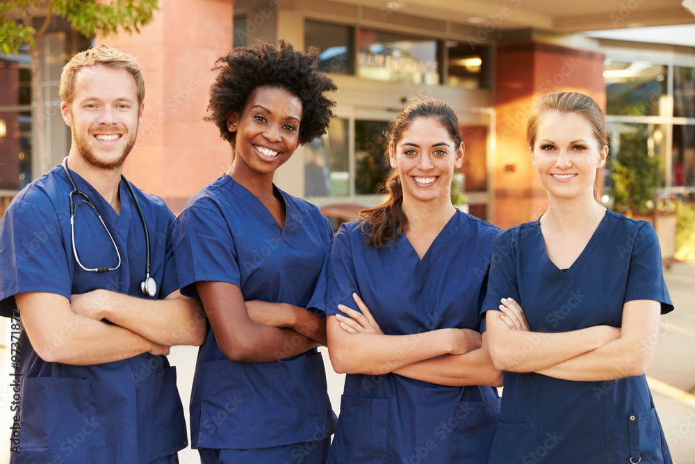© Monkey Business - Portrait Of Medical Team Standing Outside Hospital