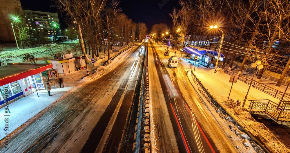 highway with fast-riding cars in winter evening city highway with fast-riding cars in winter evening city