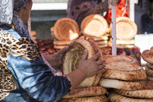 Kirghiz bread tokoch on Sunday market in Osh. Kyrgyzstan. photo