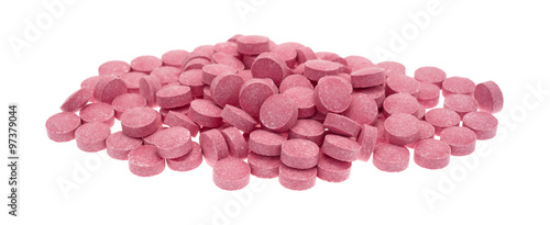 Small vitamin B12 tablets on a white background photo