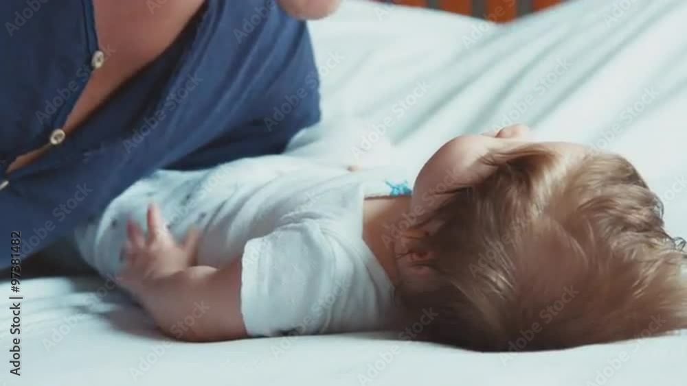 Portrait young father kissing newborn baby Portrait young father kissing newborn baby