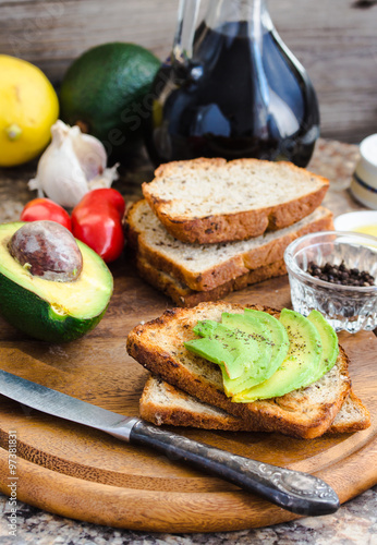 toast with fresh avocado and pepper, healthy snack, vegetarian f