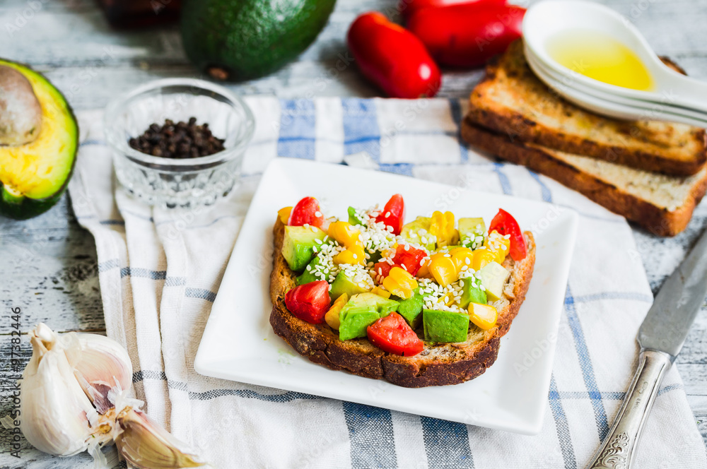 toast with fresh avocado, tomato and corn toast with fresh avocado, tomato and corn