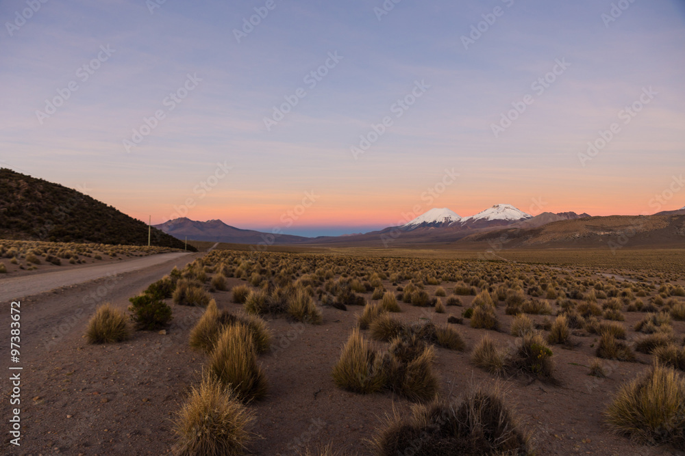 Sunset in Andes. Parinacota and Pomerade volcanos. Sunset in Andes. Parinacota and Pomerade volcanos.