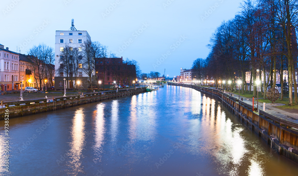 Fototapeta premium Night view of Danes river in the Old Town district. Klaipeda city, Lithuania.
