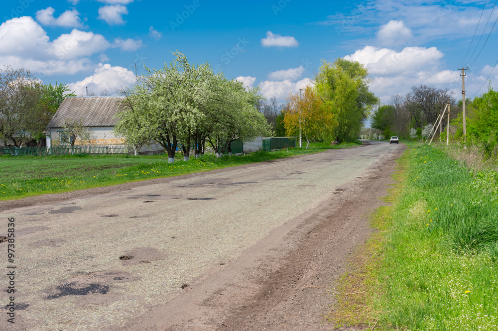 Spring landscape with old road through Dmukhailivka village, Dnepropetrovskaya oblast, Ukraine Spring landscape with old road through Dmukhailivka village, Dnepropetrovskaya oblast, Ukraine