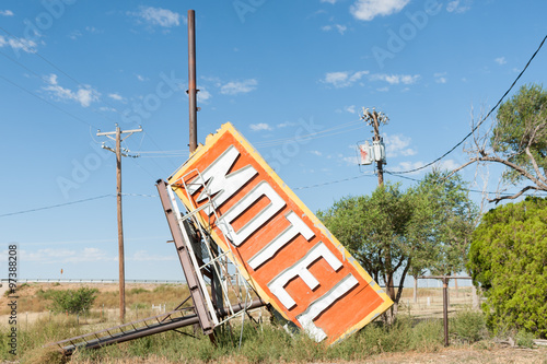 Fallen and rejected old motel sign from now deserted building along Route 66.