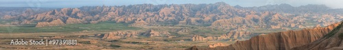 Misty Morning Panorama of the Pinnacles in Badlands National Park photo