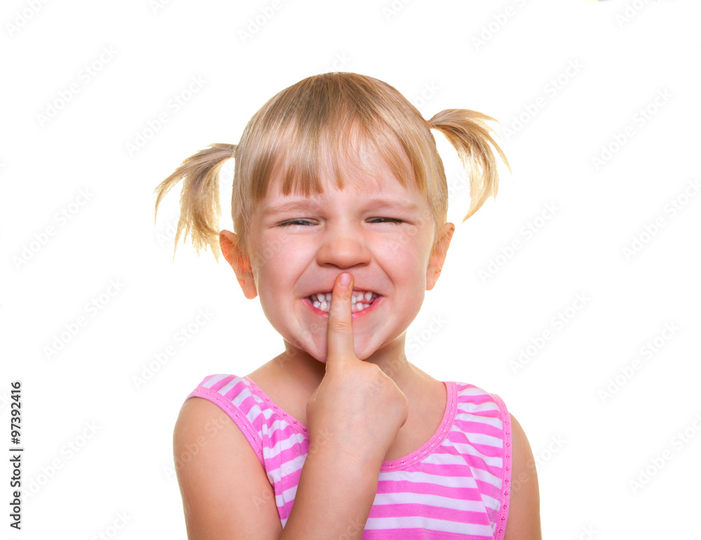 Beautiful little girl putting finger up to lips and ask silence. Isolated on white. Child doing a Please Keep Quiet gesture towards the camera Beautiful little girl putting finger up to lips and ask silence. Isolated on white. Child doing a Please Keep Quiet gesture towards the camera