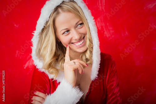 Playful woman in red Santa costume