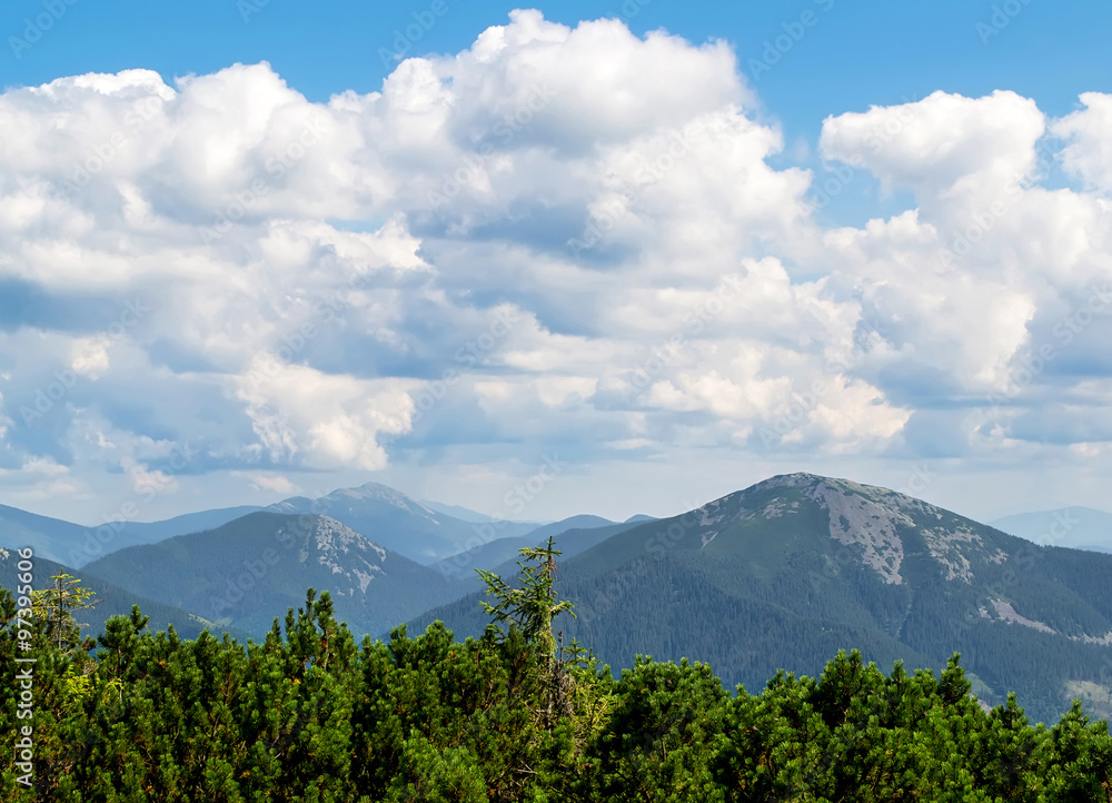 Fototapeta premium Mountain ranges under the clouds. Summer. Ukrainian Carpathians