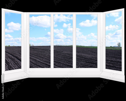 windows overlooking plowed land ready for planting