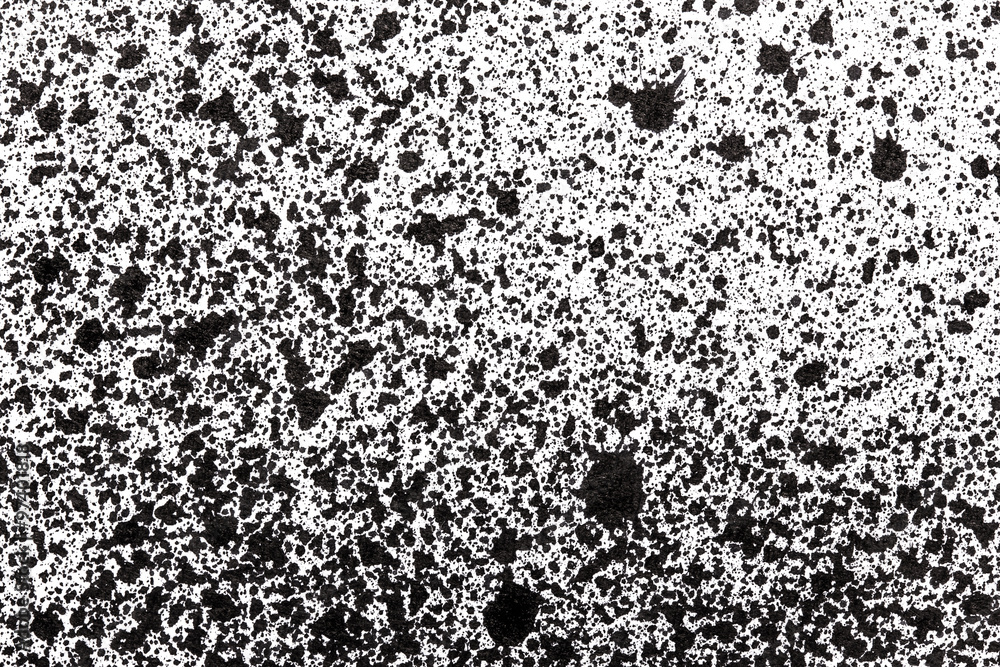 Black ink splashes on white paper texture. Black ink splashes on white paper texture.