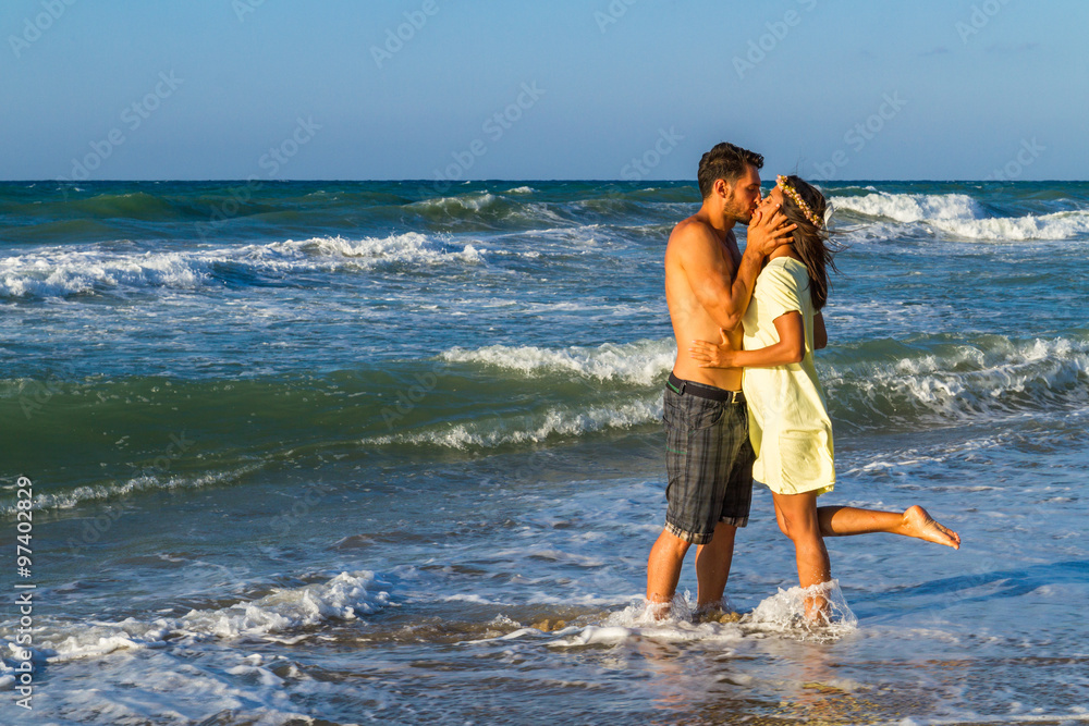 Attractive young couple in beachwear at the beach. Attractive young couple in beachwear at the beach.